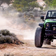 Illustration for article titled The 707 HP Jeep Wrangler Trailcat Is A Huge Green Penis Pump
